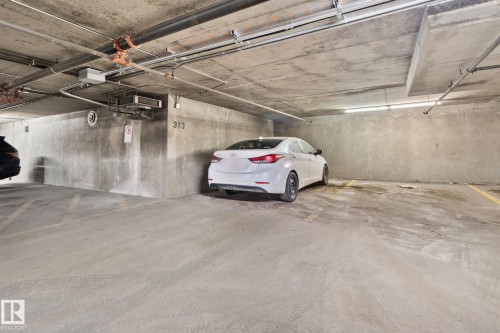 Parking deck featuring a garage door opener - 46 13825 155 Avenue, Edmonton, AB - Indoor Photo Showing Garage