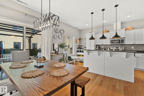 Dining area featuring light wood finished floors and recessed lighting - 46 13825 155 Avenue, Edmonton, AB - Indoor