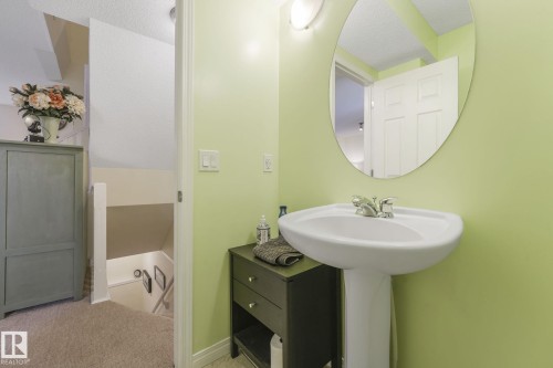 Bathroom with light carpet and baseboards - 23 4755 Terwillegar Common, Edmonton, AB - Indoor Photo Showing Bathroom
