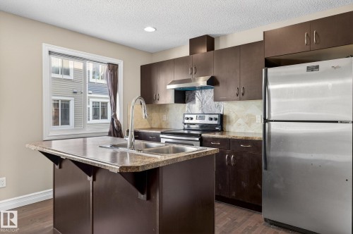 Edmonton, AB - Indoor Photo Showing Kitchen With Stainless Steel Kitchen With Double Sink With Upgraded Kitchen