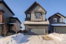 View of front of home with board and batten siding and a garage - 37 Rhea Crescent, St. Albert, AB  - Outdoor With Facade 