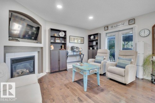 4260 24 Street, Edmonton, AB - Indoor Photo Showing Living Room With Fireplace