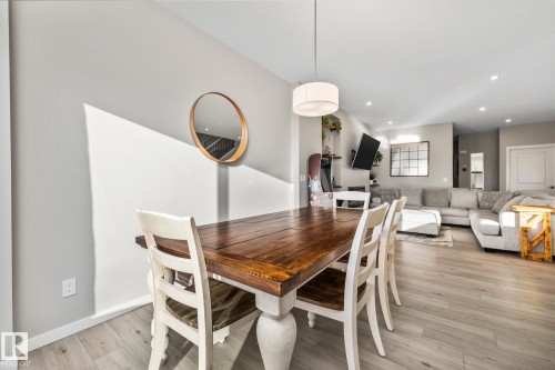 Dining area featuring light wood-style flooring and recessed lighting - 217 Larch Crescent, Leduc, AB - Indoor Photo Showing Dining Room