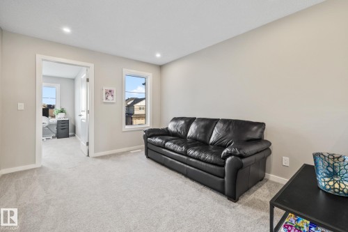 Living area featuring carpet floors and recessed lighting - 217 Larch Crescent, Leduc, AB - Indoor