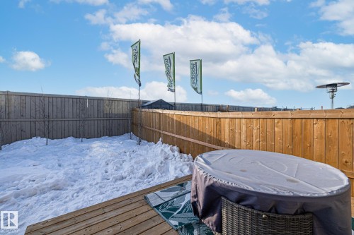 Snow covered deck featuring a fenced backyard - 217 Larch Crescent, Leduc, AB - Outdoor