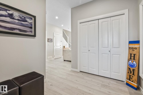 Corridor with light wood finished floors and recessed lighting - 217 Larch Crescent, Leduc, AB - Indoor Photo Showing Other Room