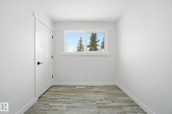 Unfurnished room featuring light wood finished floors and baseboards - 