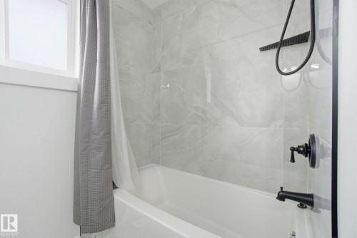 Bathroom with shower / bathtub combination with curtain - 7112 132 Avenue, Edmonton, AB - Indoor Photo Showing Bathroom