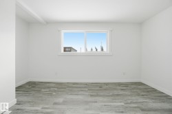 Empty room with light wood finished floors - 