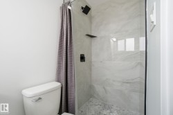 Full bath with a shower stall and toilet - 