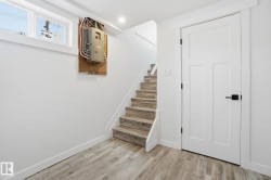 Stairway with wood finished floors and electric panel - 