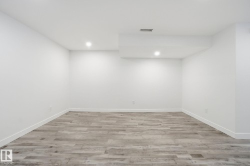 Unfurnished room with light wood-style floors and recessed lighting - 7112 132 Avenue, Edmonton, AB - Indoor Photo Showing Other Room