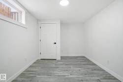 Unfurnished room with light wood-style flooring and baseboards - 