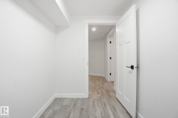 Corridor with baseboards and light wood-style floors - 