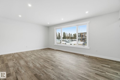 Unfurnished room with recessed lighting and light wood-style floors - 7112 132 Avenue, Edmonton, AB - Indoor