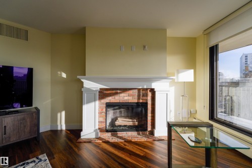 602 11710 100 Avenue, Edmonton, AB - Indoor Photo Showing Living Room With Fireplace