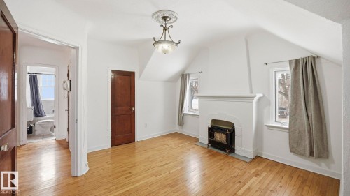 10149 122 Street, Edmonton, AB - Indoor Photo Showing Other Room With Fireplace