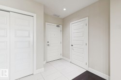 Tiled entryway featuring baseboards and recessed lighting - 