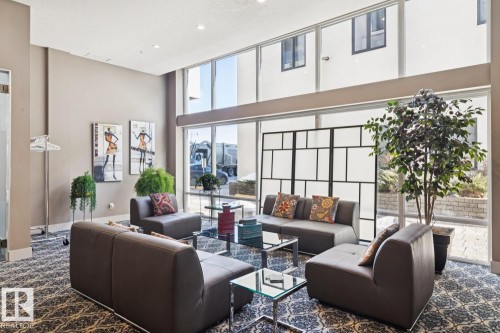 Community lobby featuring a high ceiling - 208 1350 Windermere Way, Edmonton, AB - Indoor Photo Showing Living Room