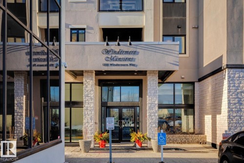 Doorway to property featuring french doors - 208 1350 Windermere Way, Edmonton, AB - Outdoor With Balcony