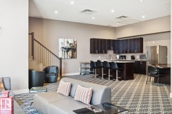 Living area featuring stairway, dark carpet, a high ceiling, and recessed lighting - 