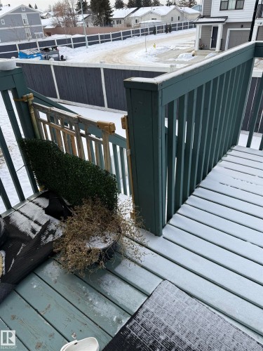 View of snow covered back of property - 11 15128 22 Street, Edmonton, AB - Outdoor With Exterior