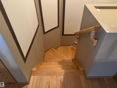 Stairs with wood finished floors - 6562 158 Avenue, Edmonton, AB - Indoor Photo Showing Other Room