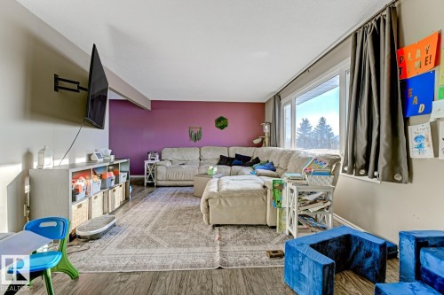 Living area featuring wood finished floors - 11516 152A Avenue, Edmonton, AB - Indoor