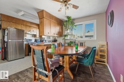 Dining room featuring ceiling fan - 