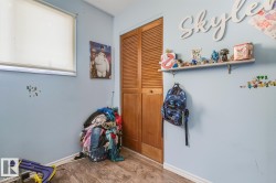 Recreation room featuring wood finished floors and baseboards - 