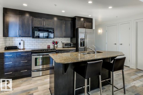 205 11933 Jasper Avenue, Edmonton, AB - Indoor Photo Showing Kitchen With Double Sink With Upgraded Kitchen