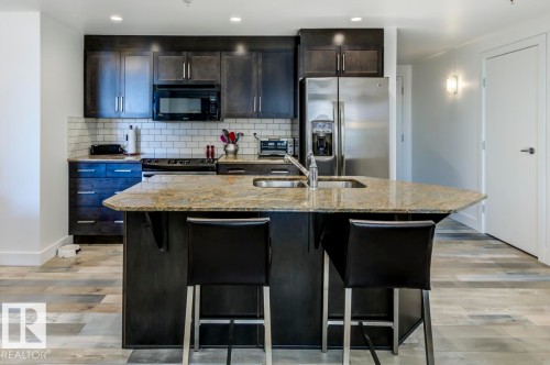 205 11933 Jasper Avenue, Edmonton, AB - Indoor Photo Showing Kitchen With Double Sink With Upgraded Kitchen