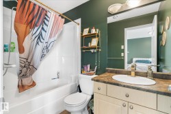 Full bathroom with shower / tub combo, vanity, and connected bathroom - 