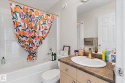 Bathroom with vanity and shower / tub combo - 