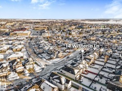 Aerial view of property's location with nearby suburban area - 