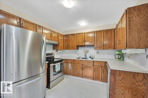 4240 38 Street Nw, Edmonton, AB - Indoor Photo Showing Kitchen With Double Sink
