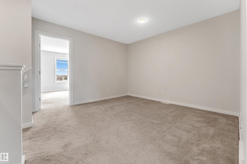 Spare room with light colored carpet and baseboards - 2095 Maple Road, Edmonton, AB - Indoor Photo Showing Other Room