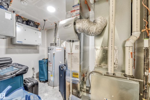 Utility room featuring water heater and heating unit - 2095 Maple Road, Edmonton, AB - Indoor Photo Showing Basement