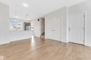 Unfurnished living room with stairway and light wood-type flooring - 2095 Maple Road, Edmonton, AB  - Indoor 