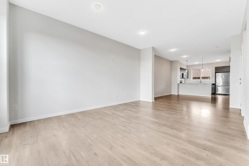 Unfurnished living room with light wood-style floors and recessed lighting - 2095 Maple Road, Edmonton, AB - Indoor