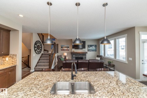 13020 207 Street, Edmonton, AB - Indoor Photo Showing Kitchen With Fireplace With Double Sink With Upgraded Kitchen
