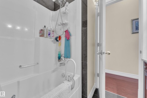 Bathroom with bathing tub / shower combination and vanity - 2012 69 Street, Edmonton, AB - Indoor Photo Showing Bathroom