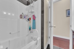 Bathroom with bathing tub / shower combination and vanity - 