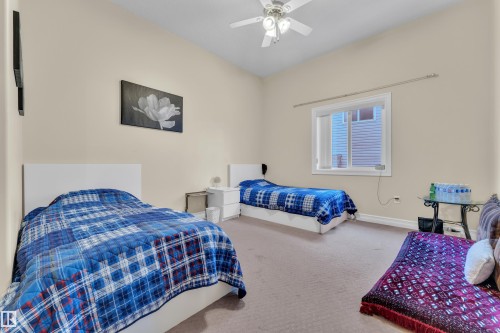 Bedroom with carpet flooring and a ceiling fan - 2012 69 Street, Edmonton, AB - Indoor Photo Showing Bedroom