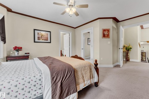Bedroom featuring carpet, crown molding, and a ceiling fan - 2012 69 Street, Edmonton, AB - Indoor Photo Showing Bedroom