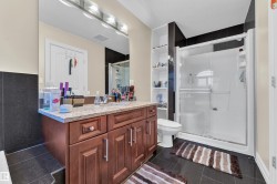Full bath with vanity and a stall shower - 