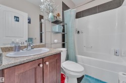Bathroom with vanity and shower / bath combo - 