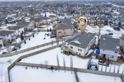 Snowy aerial view featuring a residential view - 