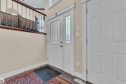 Foyer entrance featuring baseboards - 