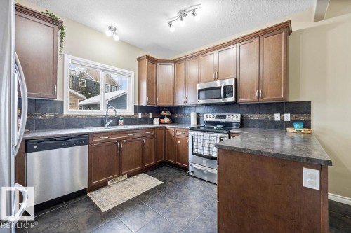 7931 22 Avenue, Edmonton, AB - Indoor Photo Showing Kitchen With Stainless Steel Kitchen With Double Sink
